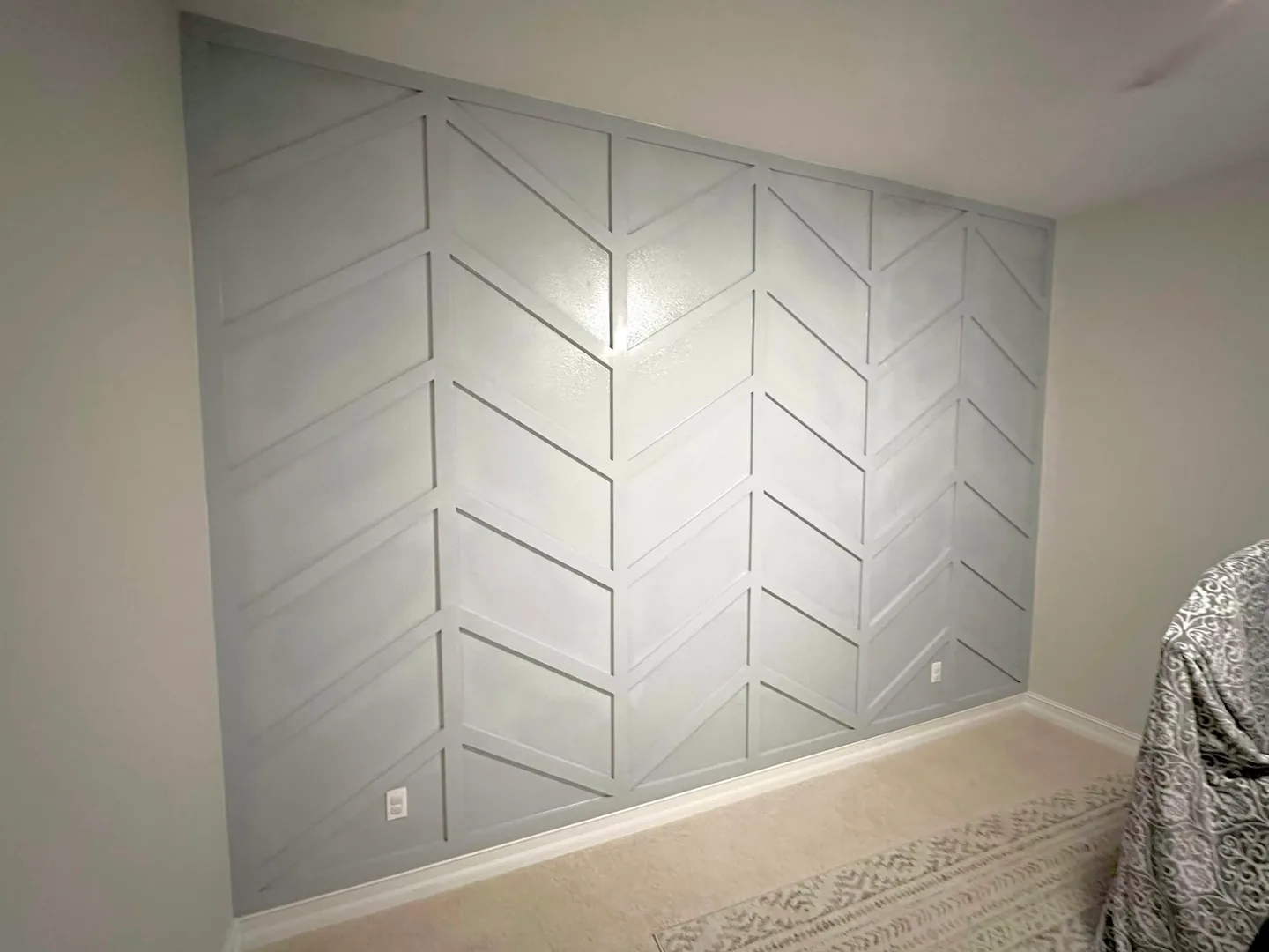 Custom geometric accent wall with decorative trim